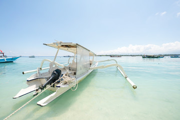 Fototapeta premium Tropical sandy beach with boats in a sea. Gili Trawangan Lombok