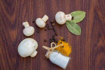 mushrooms salt spices and olives on wooden Boards