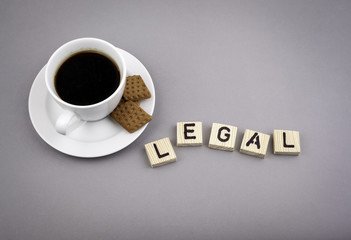 Text: Legal from wooden letters on a gray background.