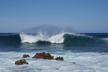 Waves coming ashore on the rocky coast of Easter Island (Papa Nui) in the Pacific Ocean