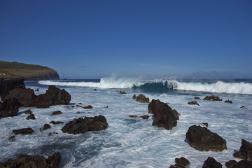 Waves coming ashore on the rocky coast of Easter Island (Papa Nui) in the Pacific Ocean