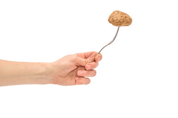Cutlet on a fork in hand isolated on white