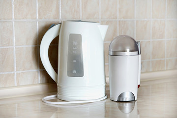 Interior of a kitchen with household appliances on the table