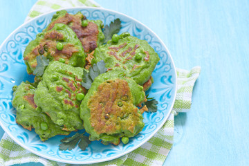 Fresh green pea fritters with herbs
