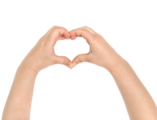 Children's hands show heart. Isolated on white.