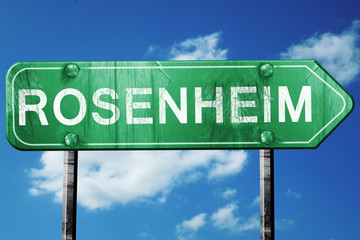 Rosenheim road sign, vintage green with clouds background