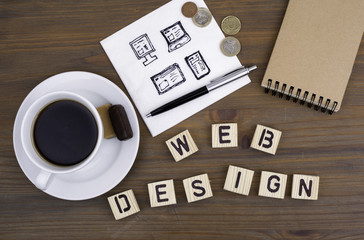 Text: Web design from wooden letters on awooden table