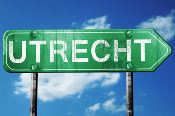 Utrecht road sign, vintage green with clouds background