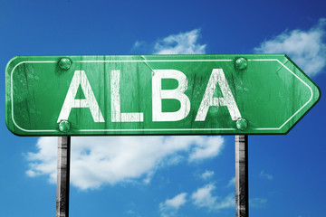 Alba road sign, vintage green with clouds background