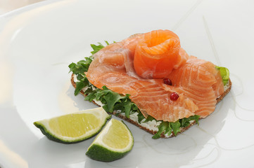 sandwiches of salmon with salad leaves