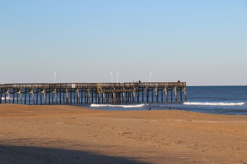 Fototapeta premium Long Pier on Beach into Ocean