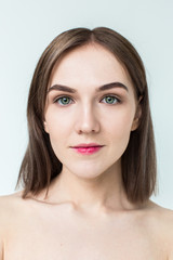 Obraz premium Beauty portrait of young model with middle length hair. Professional nude makeup. Green eyes.