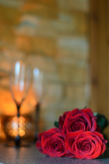 Closeup of beautiful fresh roses in a fine dinning setting.