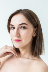Fototapeta premium Beauty portrait of young model with middle length hair. Professional nude makeup. Green eyes.