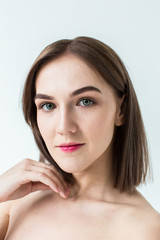 Fototapeta premium Beauty portrait of young model with middle length hair. Professional nude makeup. Green eyes.