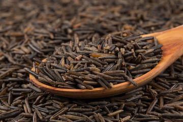 Wild brown rice in spoon