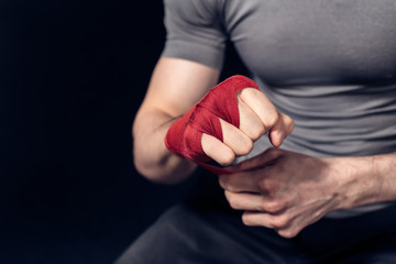 Boxer is prepairing to fight Fists of fighter before the fight or training in sport gym.