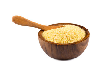 Raw couscous in a wooden bowl