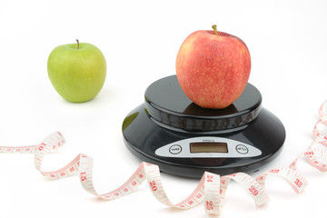 black digital scale, weight green apple