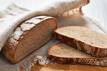 Sliced loaf of gray floured bread