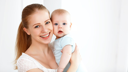 happy family mother playing  with baby