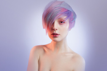 young girl with pink eyes and hair, like a doll