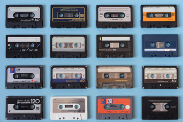 Set of vintage audio tape cassettes flat view, on light blue background