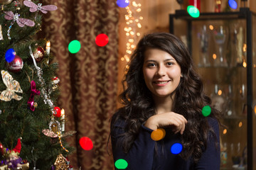 Smiling girl with Christmas tree