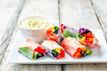 rainbow spring rolls with avocado white bean hummus