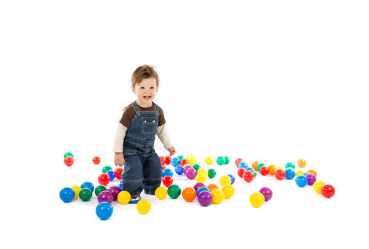 baby plays with color balls