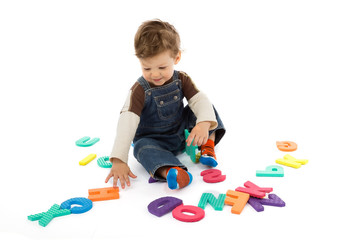 babay plays with letters