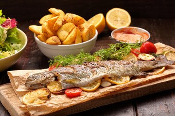 Baked fish with roasted potatoes and salad