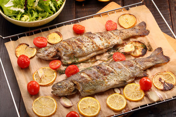 Whole baked fish on the grill