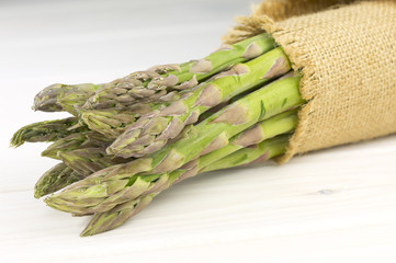 Asparagus on white wooden background