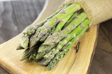 Asparagus on wooden background