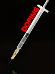 Stop doping concept. Medical syringe isolated on black