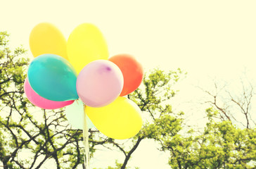 Balloons flying on sky background. Retro style