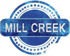 mill creek grunge blue stamp. Isolated on white.