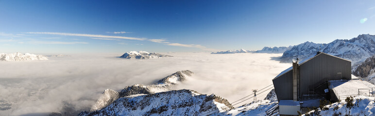 XXL Panorama - Winter view from a viewing platform on Osterfelderkopf near Germany's highest mountain (Zugspitze, 2962m). 
From the platform you can see the top station of the cable car Alpspitzbahn.