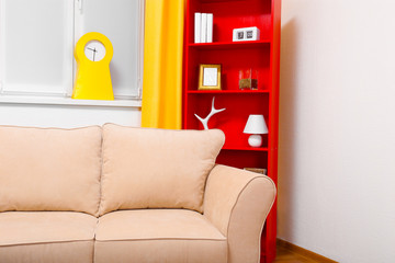 Modern interior design. Living room with sofa and bookcase
