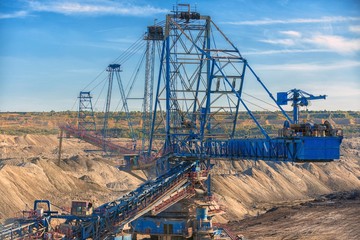 Large excavator machine in the mine