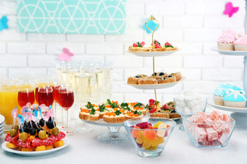 Set of cold snacks, canape, beverages and dessert, closeup