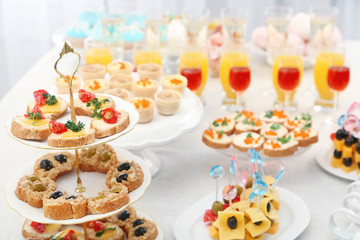 Set of cold snacks, canape, beverages, closeup