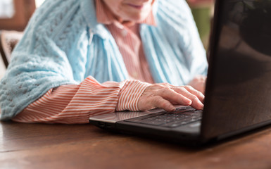 Old woman using a laptop