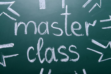 Master class inscription written with white chalk on blackboard