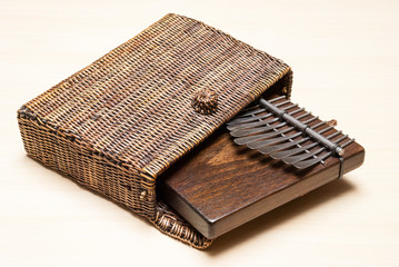 Traditional African instrument kalimba or thumb piano in a wicker case
