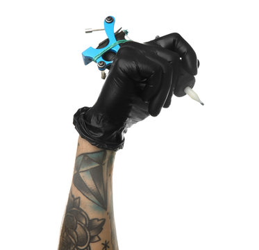 Man's Hand Holding Tattoo Machine On White Background