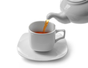 Cup of tea and teapot, isolated on white