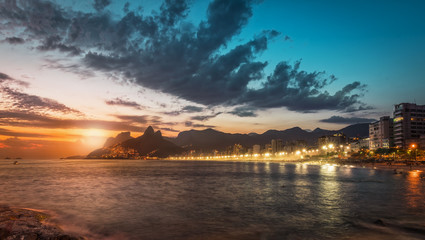 Sunset behind the mountains on Ipanema Beach, Rio de Janeiro