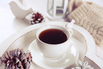 Beautiful winter composition with cup of hot drink